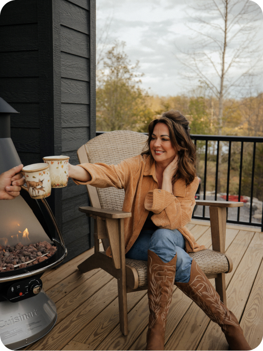 Jennifer sharing a coffee on the porch of a Peaceful Peak property